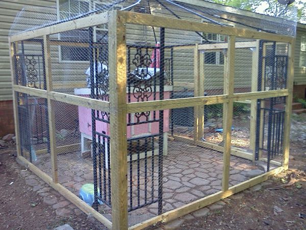 Our chicken coop/run with the hen house inside. Yes, that is a pink ...